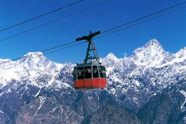 A photo from the cable car showing snow-covered Himalayan peaks.