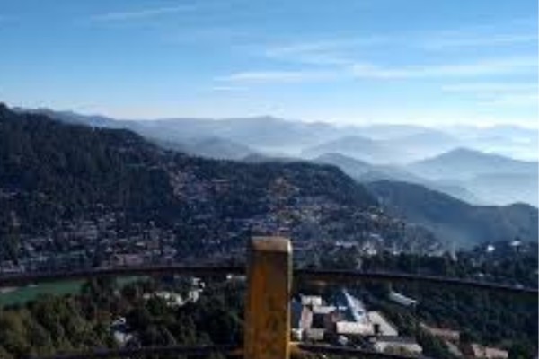 A wide shot of the view from Tiffin Top, with layers of green hills.