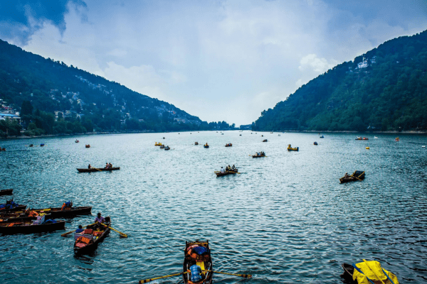 Naini Lake in Nainital with boating and scenic mountain views – a must-visit attraction in Nainital tour packages