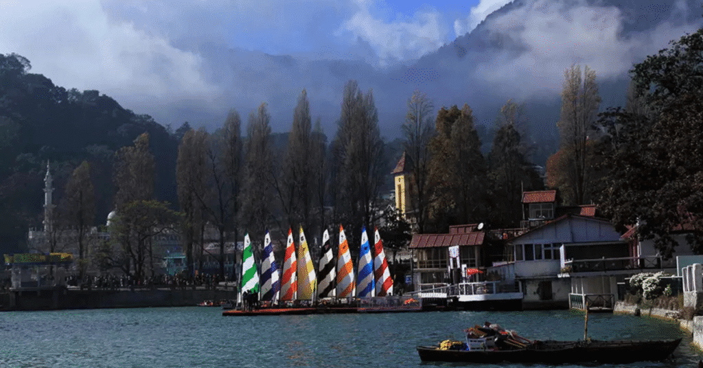 Nainital Lake surrounded by lush green hills under clear blue sky – perfect view to understand Nainital weather by month in 2025