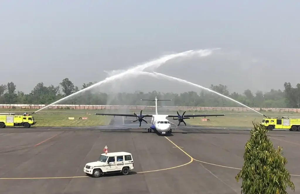 Aerial view or photo of Pantnagar Airport with planes or surrounding hills.