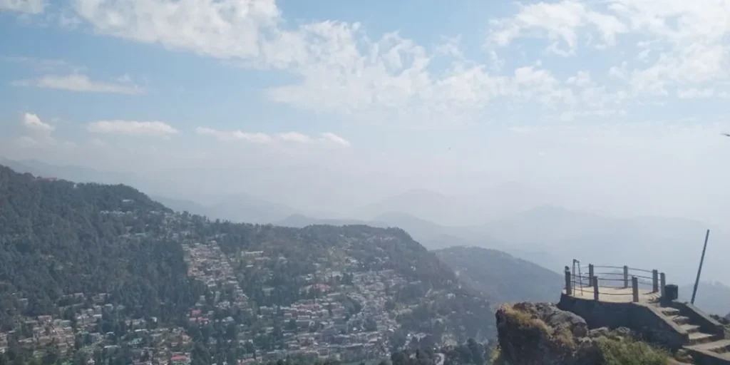 Panoramic view of Tiffin Top Nainital with hills and valleys in the background