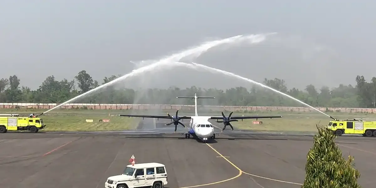 Aerial view or photo of Pantnagar Airport with planes or surrounding hills.