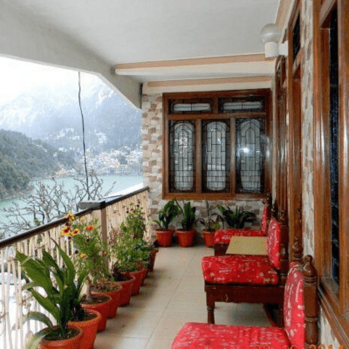 A hotel balcony or room with a direct view of Naini Lake.