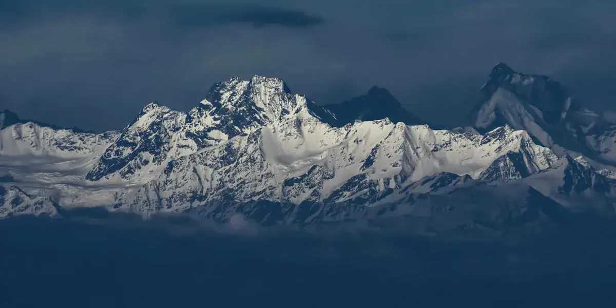 Snow-covered Himalayan peaks viewed from Nainital Snow View Point on a clear winter morning.