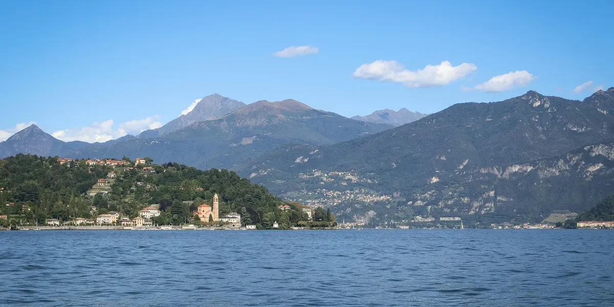 A scenic shot of Naini Lake or the surrounding hills to show the destination.
